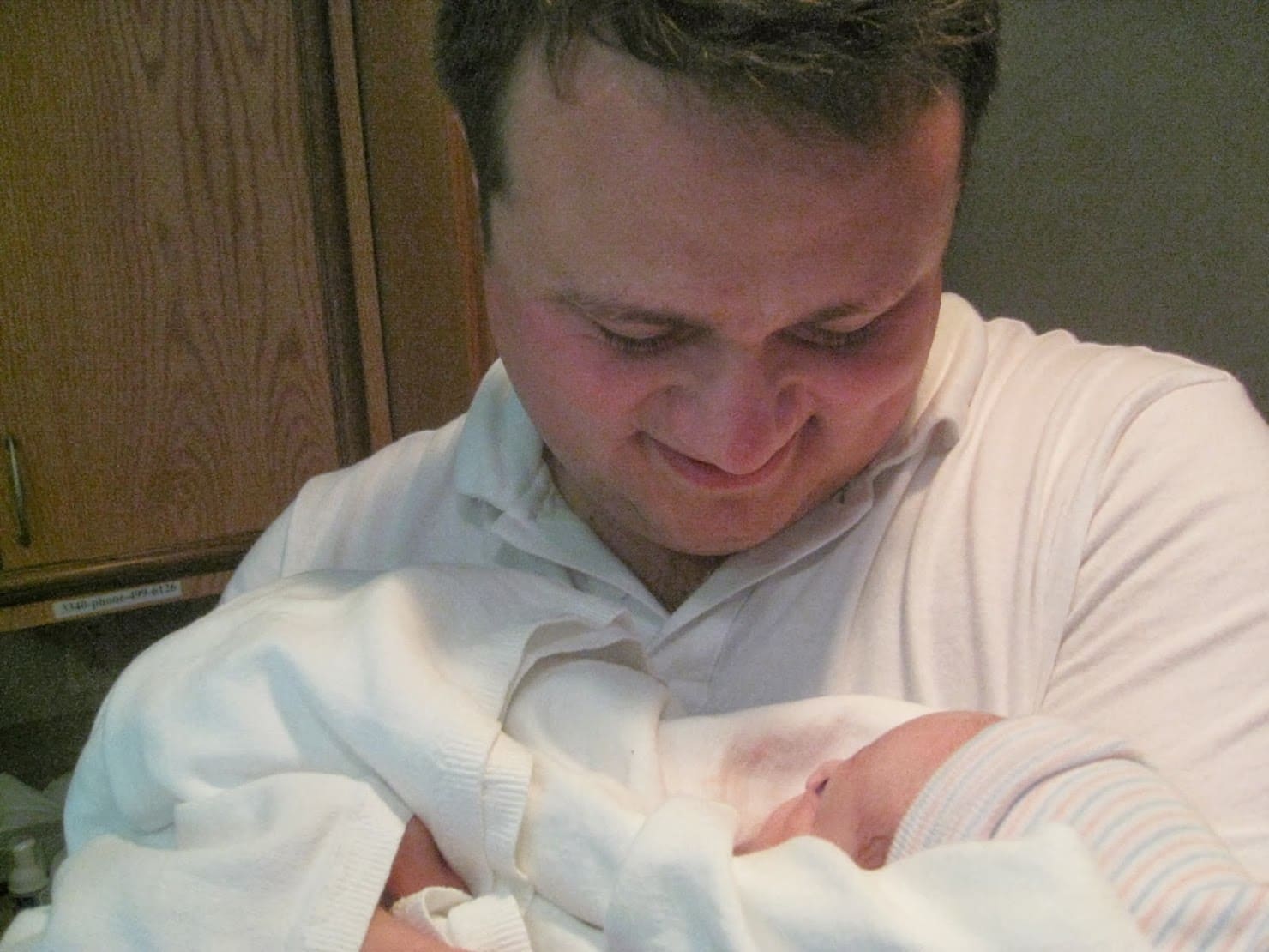 Steve looking at newborn Lucee, 2009